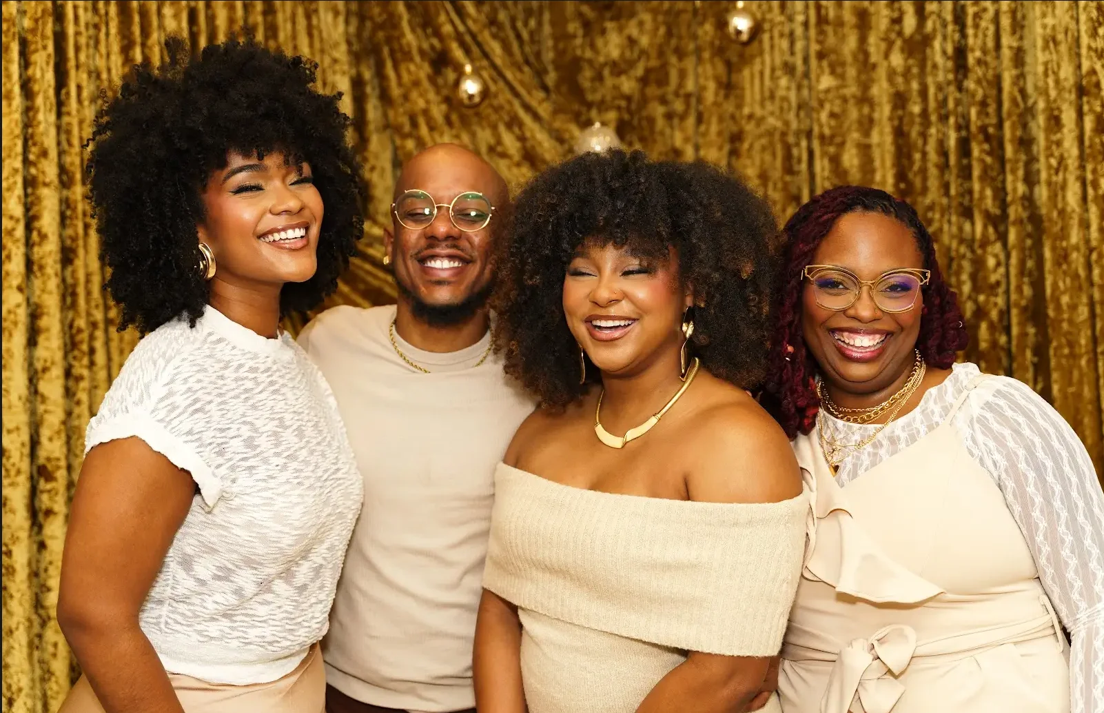 Group portrait with gold backdrop